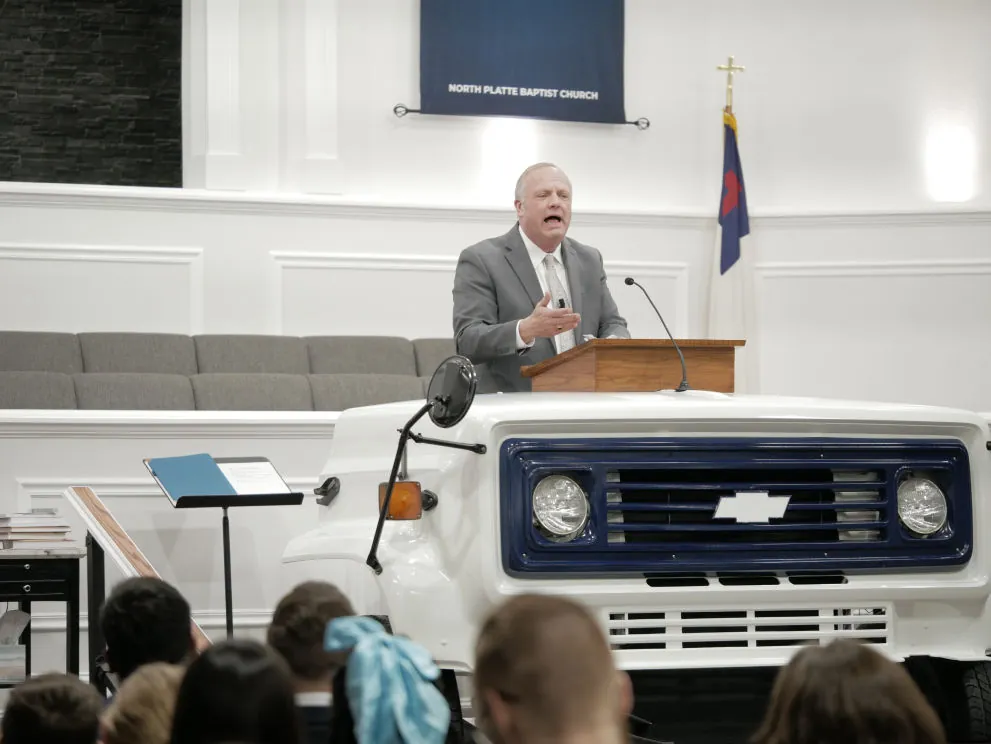 Preaching from a pulpit built from the front of a bus
