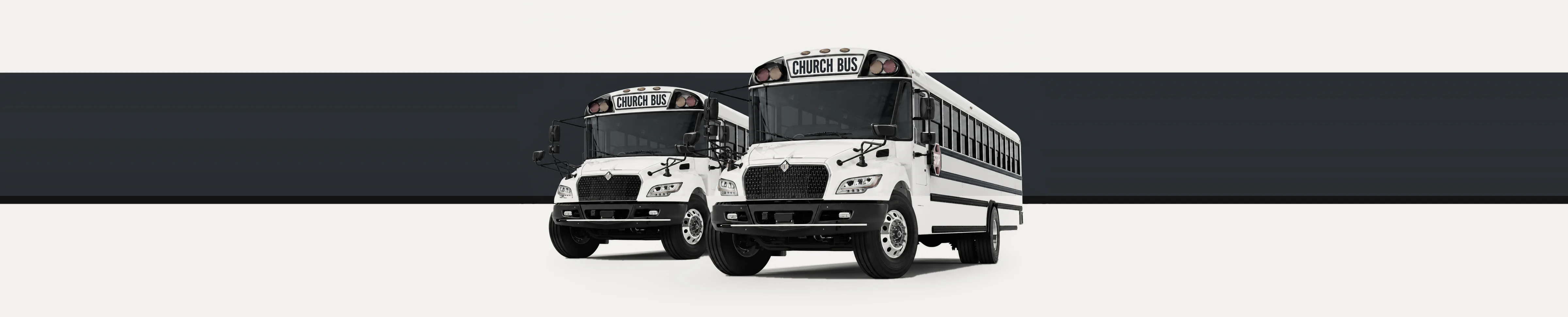 Two white church buses