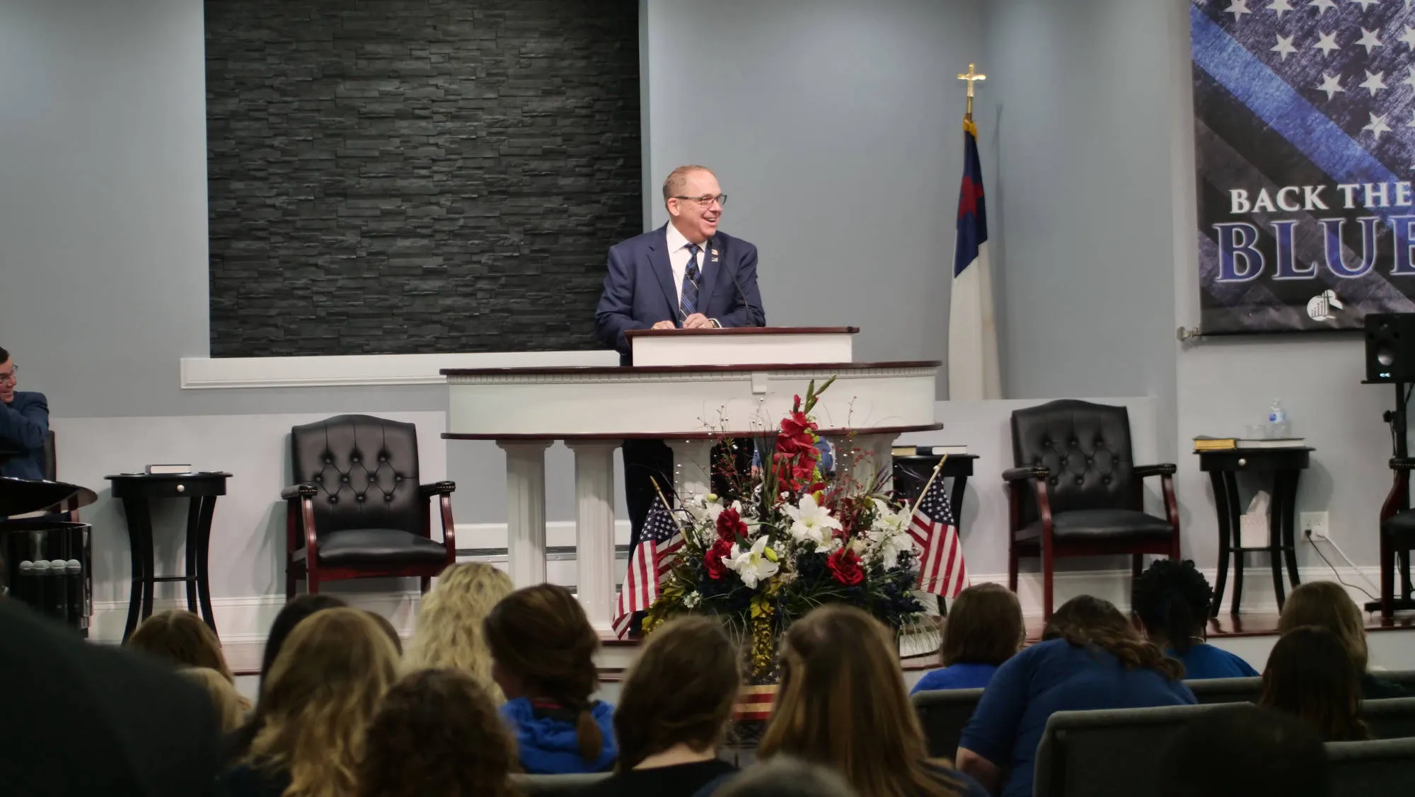 Pastor Reeves preaching from the pulpit