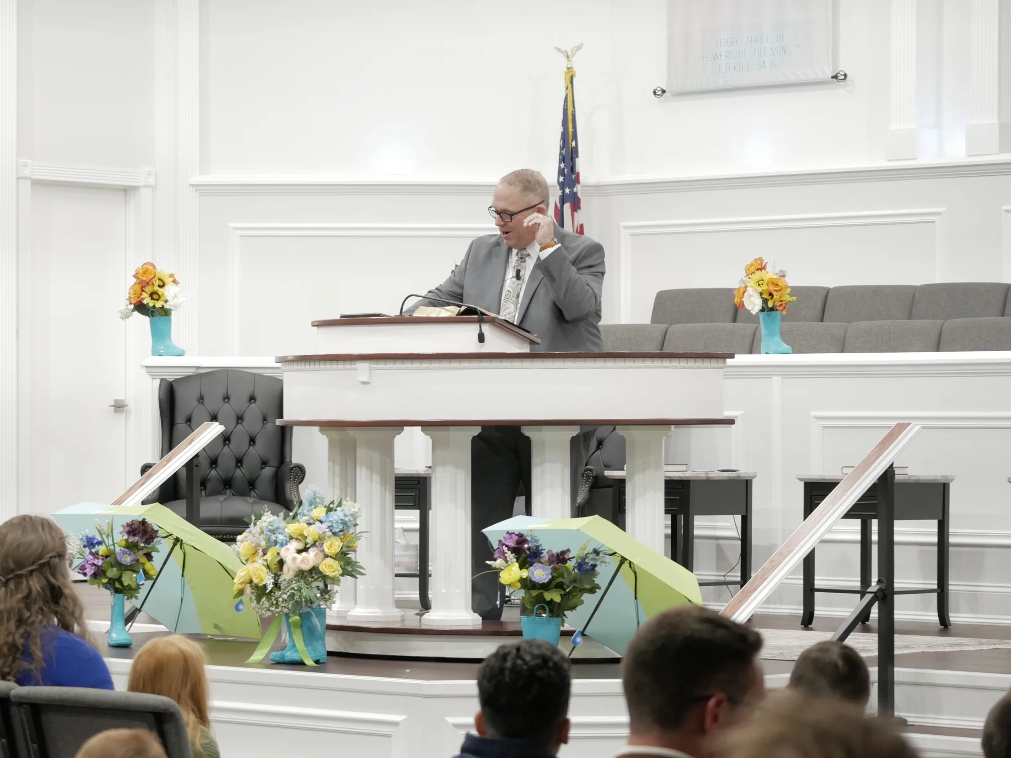 Pastor Reeves preaching from the pulpit